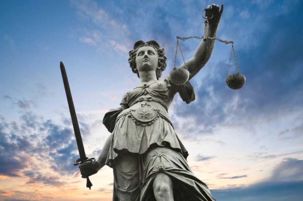 Is CBD legal? Statute of justice holding a scale